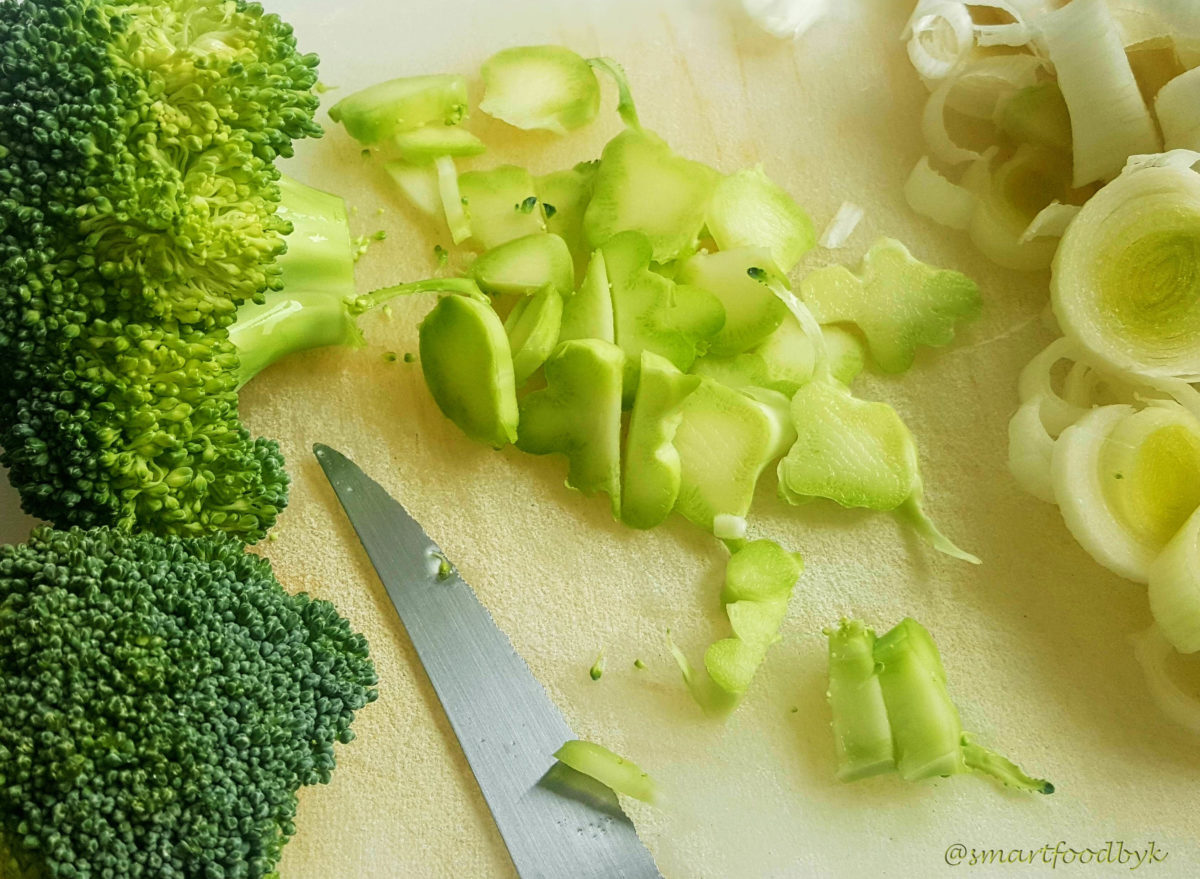 Cutting broccoli trunks.