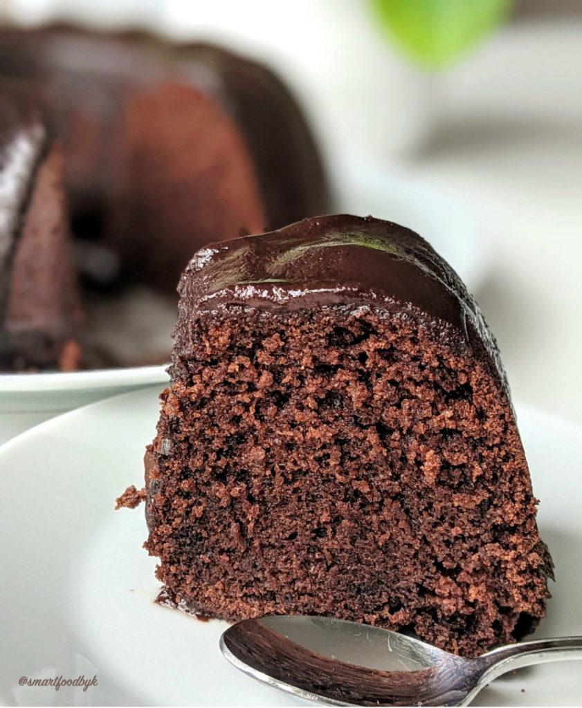 A slice of a fluffy chocolate cake.